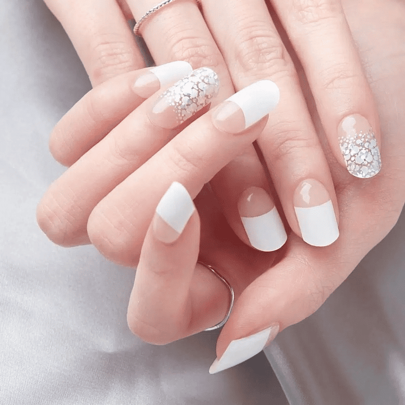 A model showcasing white nail designs