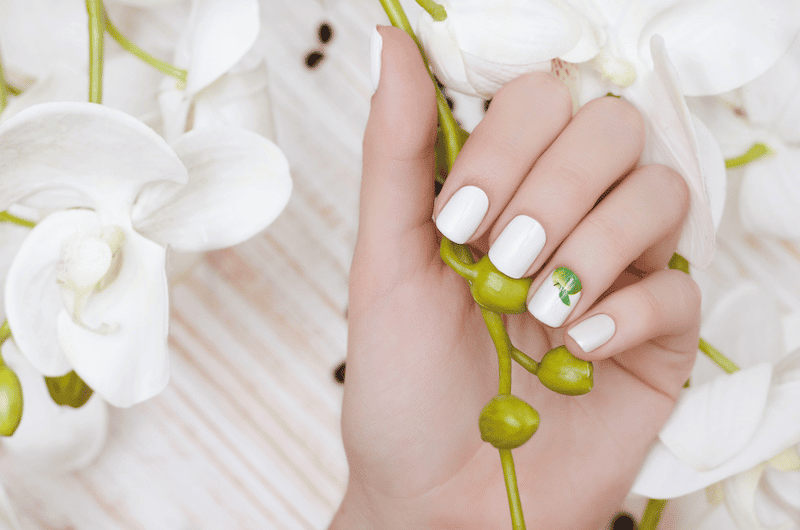 White nail designs with an apple