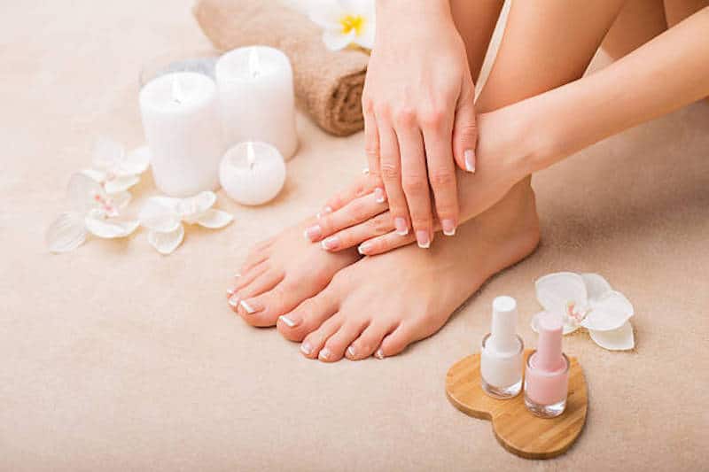 Women at spa salon after manicure and pedicure