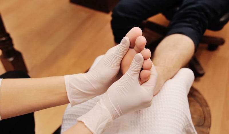 man receiving foot massage pedicure